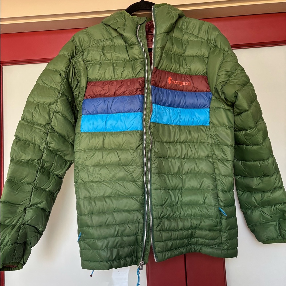 Cotopaxi Green Puffer Jacket with Blue and Brown Accents